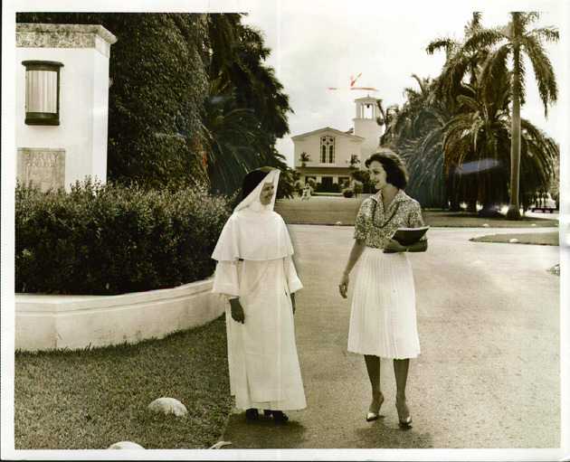 Sister Joseph Margaret and senior Christine Chomyn at the campus main entrance